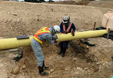 Certified Industrial Hygienist (CIH) inspecting the safety and health of workers during pipeline coating operations in Okinawa, Japan