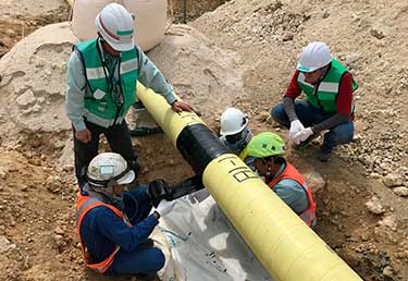 Certified Industrial Hygienist (CIH) inspecting the safety and health of workers during pipeline coating operations in Okinawa, Japan